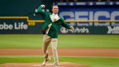 Scottie Scheffler used his Masters green coat to toss out the veryfirst pitch at a Rangers videogame