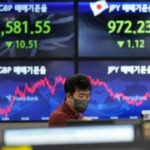 Asian shares mixed as Australia hikes interest rate