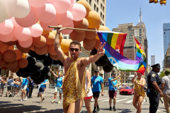 Pride Revelers Celebrate Love as Threats to LGBTQ Rights Hover