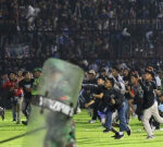 129 dead at Indonesian soccer match after authorities tear gas triggers clashing fans to stampede