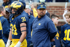 Michigan running backs coach Mike Hart hauled off after collapsing on sidelines