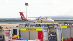 Fire emergencysituation forces remarkable evacuation of Qantas travelers from flight at Sydney Airport