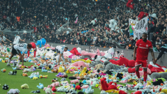 Fans of Turkish soccer club Beşiktaş J.K. toss packed toys onto pitch for kids impacted by earthquakes