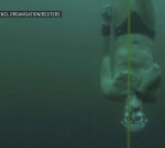 View this scubadiver plunge into icy Swiss lake