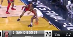 San Diego State’s Lamont Butler directly prevented stepping out of bounds priorto his buzzer-beater