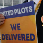 Pilots at United picket for greater pay as pressure constructs priorto summertime travel season