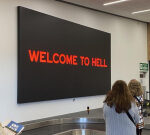 Hobart Airport’s choice to eliminate Dark Mofo’s ‘Welcome to hell’ indication an ‘overreaction’