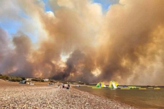 2,000 individuals consistingof travelers left as a wildfire raves on the Greek island of Rhodes