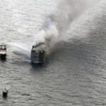 A truck bring almost 3,000 vehicles captures fire in the North Sea and a team member is eliminated