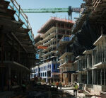 Clark tops out veryfirst of 3 towers at Washington, DC, apartmentorcondo task