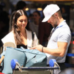 Newlyweds Derek Hough and Hayley Erbert pack on the PDA at LAX following fairy-tale weddingevent