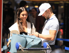 Newlyweds Derek Hough and Hayley Erbert pack on the PDA at LAX following fairy-tale weddingevent