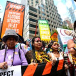 Thousands march to kick off environment top, requiring an end to fossil fuels