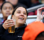 Fans go wild after finding Matildas superstar Sam Kerr in the crowd drinking a beer
