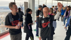 99-year-old guy climbsup CN Tower for charity