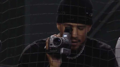 Devin Booker with a camcorder at the Diamondbacks playoff videogame endedupbeing an immediate meme