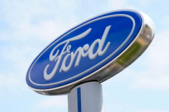 Ford profits fall brief of approximates after it strikes a tentative offer with the United Auto Workers