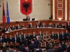 Albania’s opposition interrupts a budgetplan vote with flares and piled-up chairs in Parliament