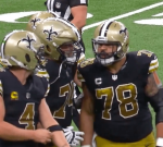 Derek Carr and Saints center Erik McCoy got into a warmed exchange while walking off the field