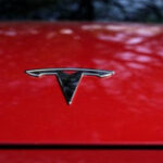 Tesla’s stock slides after revenues come up brief and EV maker cautions of slowing development in 2024