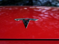 Tesla’s stock slides after revenues come up brief and EV maker cautions of slowing development in 2024