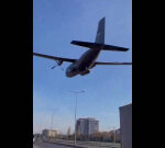 Turkish military airplane buzzes right over streets, field