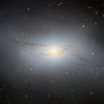 Gemini South telescope records sensational image of strange galaxy with twisted dust lanes