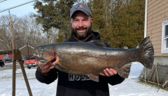 Angler finagles record rainbow trout through small hole in ice