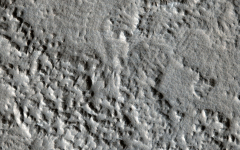 Distant secondary craters: The largest new crater to have formed on Mars