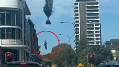 Heart-stopping minute buildingandconstruction employee raised into the air by crane in South Perth