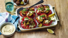 Courtney Roulston makes a enjoyable household supper, packed capsicums filled with rice, hommus and falafel