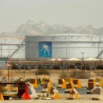 Saudi Arabia’s Aramco reports lower half-year earnings as financial concerns moisten energy costs