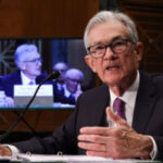 As inflation falls, Federal Reserve cuts interest rates half portion point