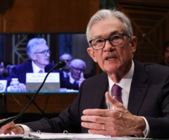 As inflation falls, Federal Reserve cuts interest rates half portion point