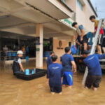 Companies battle to offer with flood damage