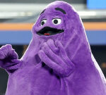 Mets fans were so delighted to see Grimace while riding the train to Citi Field