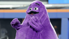 Mets fans were so delighted to see Grimace while riding the train to Citi Field