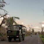 Crowds in Mayotte vent frustration with cyclone response as Macron tours devastation