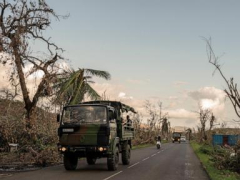 Crowds in Mayotte vent frustration with cyclone response as Macron tours devastation