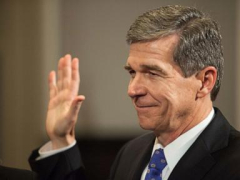 After fighting virus, storms and Republicans, departing North Carolina Gov. Cooper focuses on wins