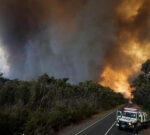 Storms may pose new fire threat after states scorched and thousands evacuated