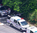 Two people, including a police officer, injured in Annerley shooting