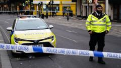 Man arrested on suspicion of attempted murder after four people hit by car