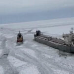 Freighter remains stuck in the ice on a frozen Lake Erie