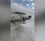 US airliner flips on back in crash landing at Toronto airport