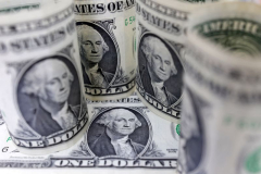 Dollar edges up from 11-week low amid soft U.S. data, tariff uncertainty