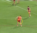 Suns midfielder Bailey Humphrey gives away 50-metre penalty throwing ball of mud at Jarrod Berry