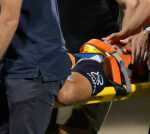 Wallabies star Noah Lolesio stretchered off with suspected spinal injury