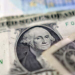 Dollar holds near six-week low as trade war wears on US economy