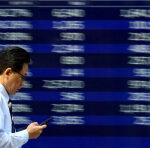 Stocks, dollar stay calm in Asia as oil rises